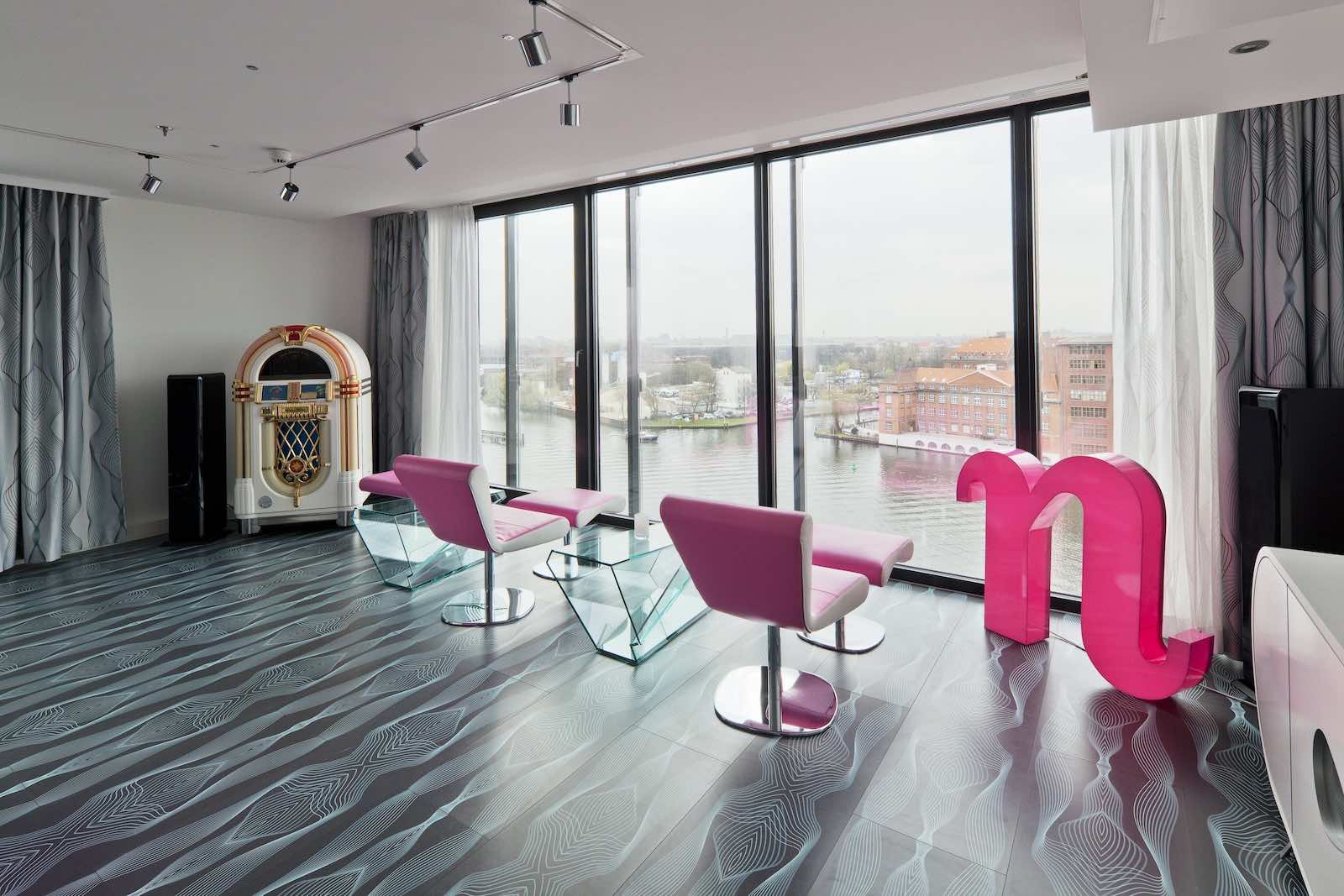 nhow_berlin- pink chairs juke box and river views