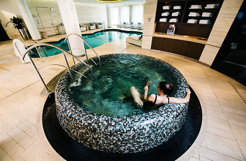 Woman relaxing in spa hot tub - Waldorf Astoria Berlin