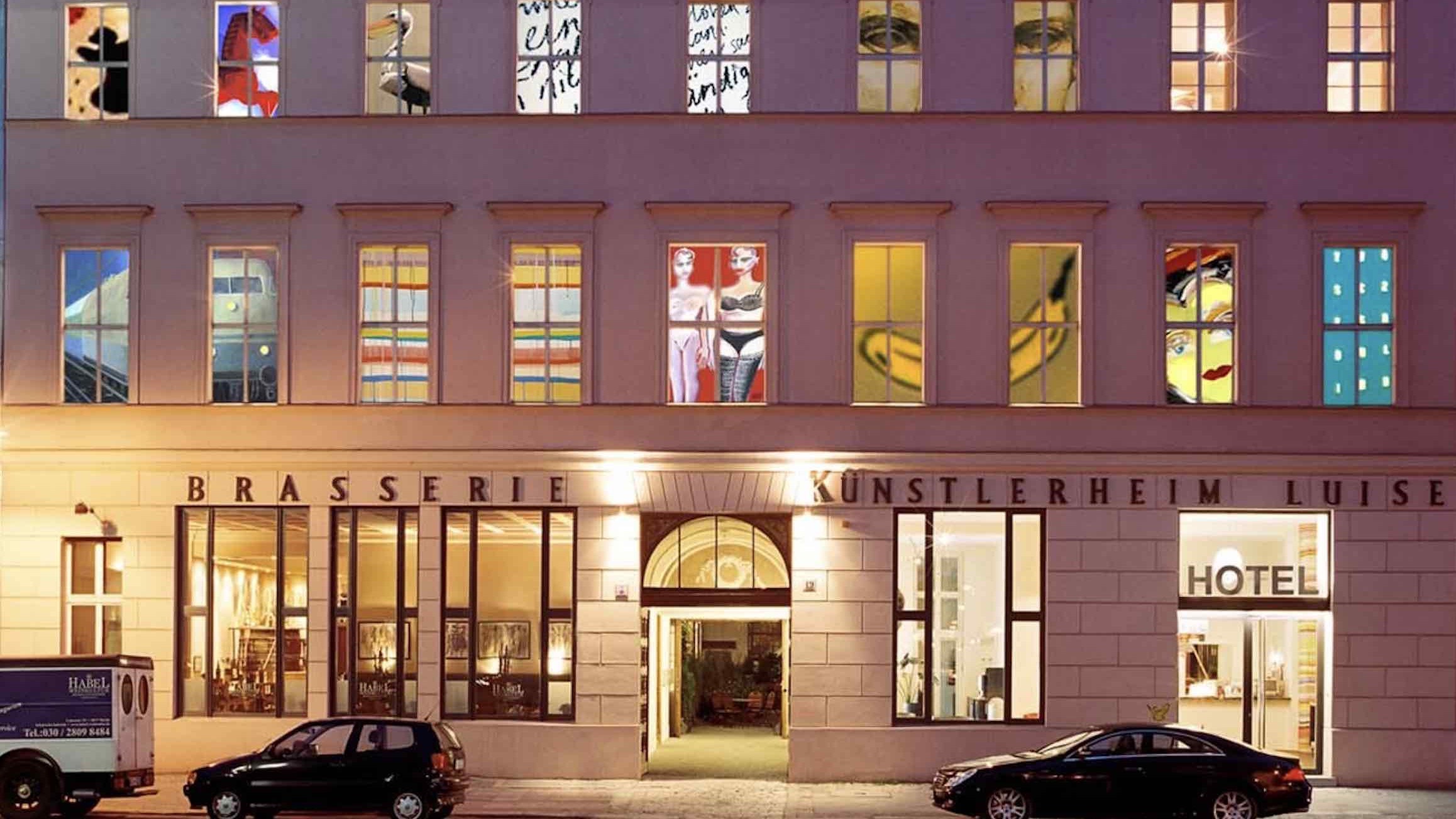 Arte Luise Arthotel unique hotels in berlin exterior at night with painted windows