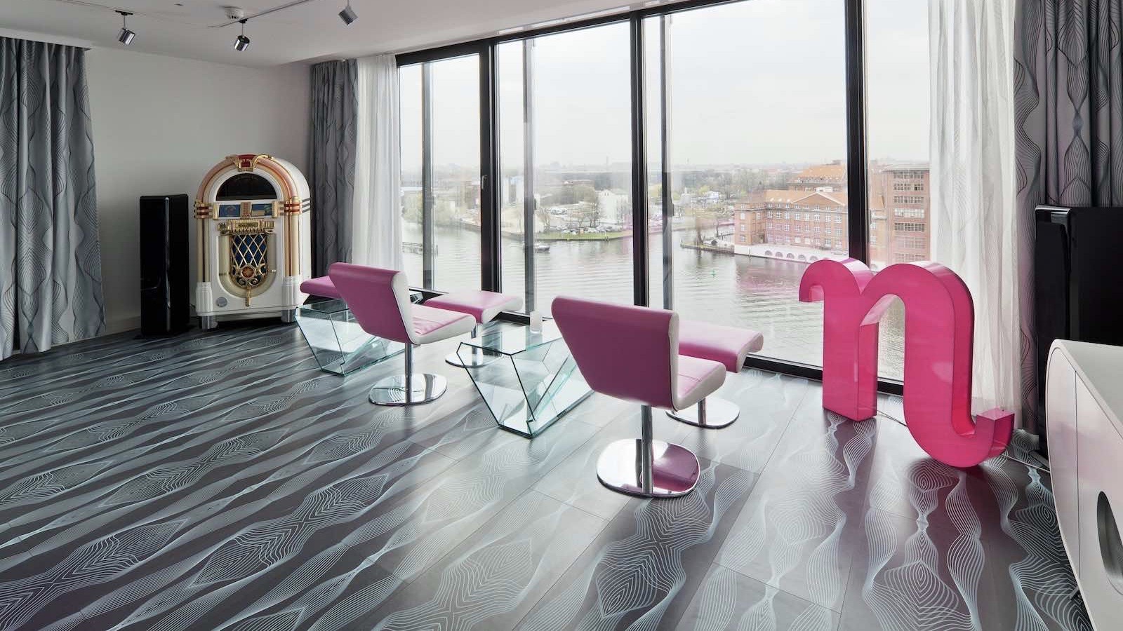 nhow berlin- pink chairs juke box and river views in one of the coolest hotels in berlin